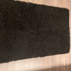 Used and slighty heat damaged Fluffy Area Rug